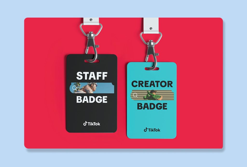 staff and creator event badges attached to white lanyards